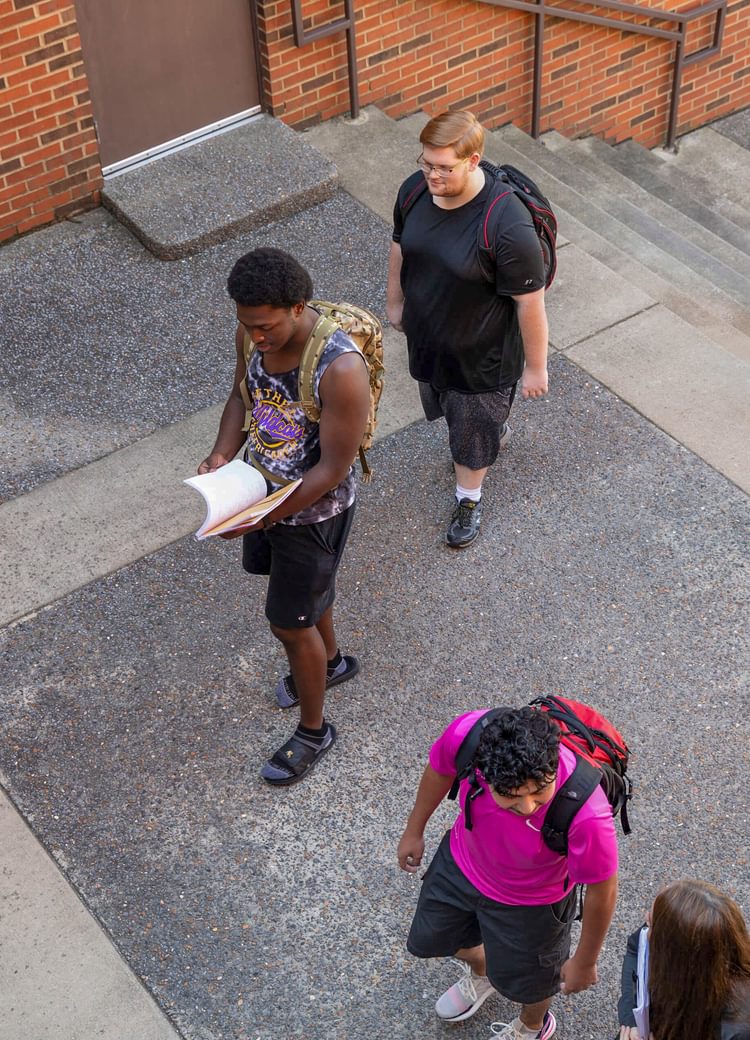 a group of students walk to class