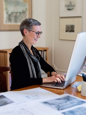 an historian conducts some research from her office