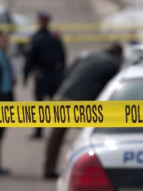 police line tape strung up at a crime scene