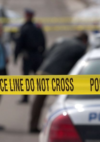 police line tape strung up at a crime scene