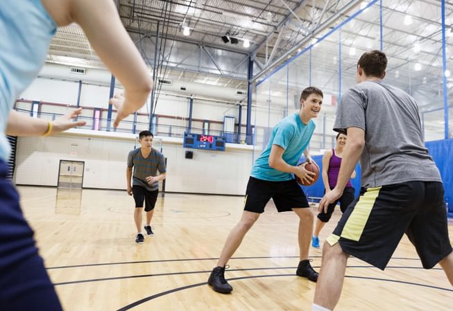 several students play intramural basketball