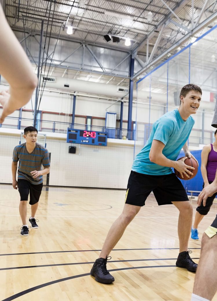 several students play intramural basketball