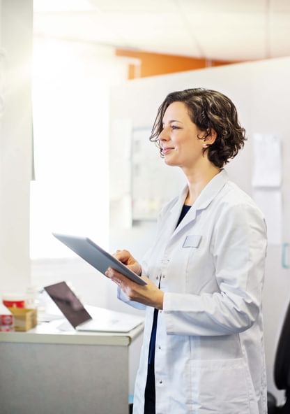 a PA takes notes in a doctor's office