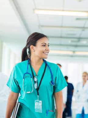 a nurse walks down the hall of a hospital