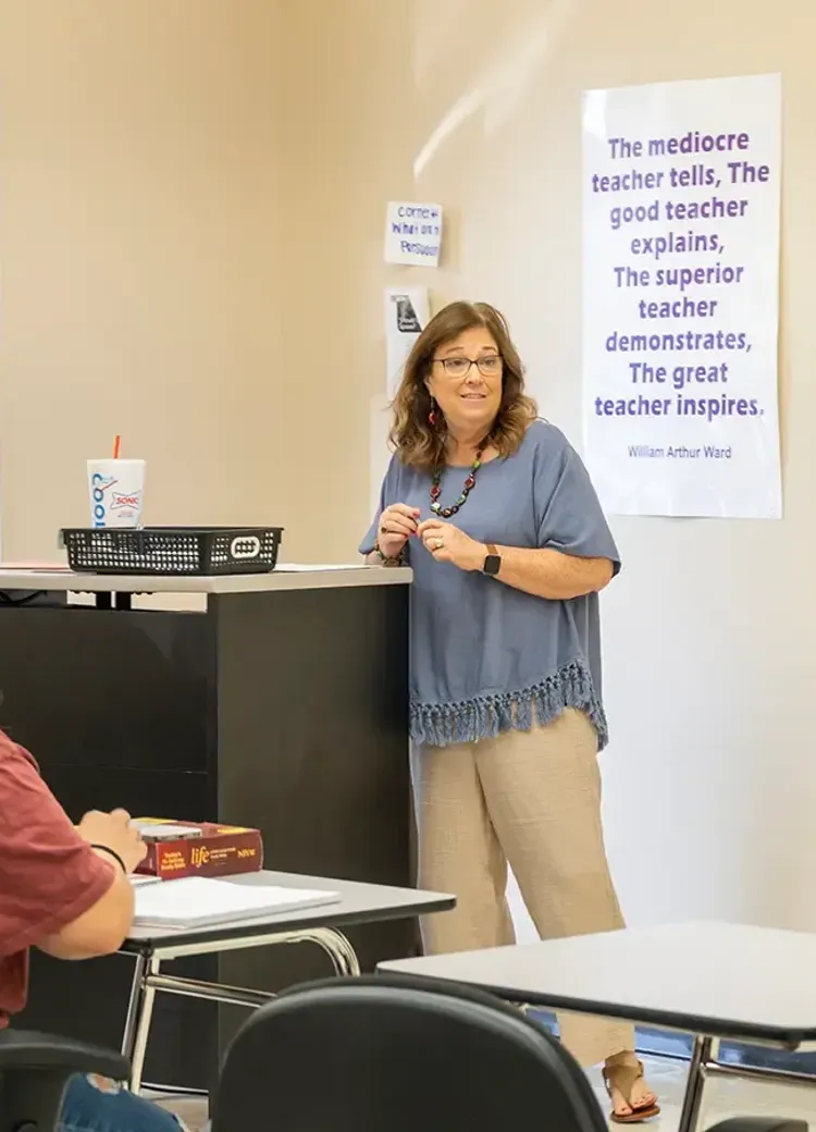 Professor teaching a group of students in an education course.