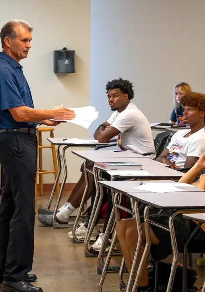 Professor speaking to students during a classroom lesson