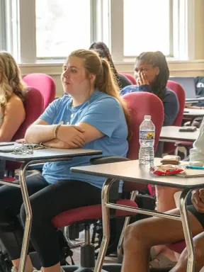 College students listen during a class in a Bethel classroom.