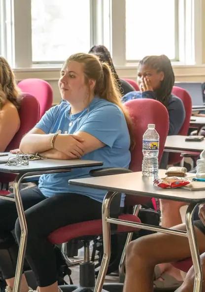 College students listen during a class in a Bethel classroom.
