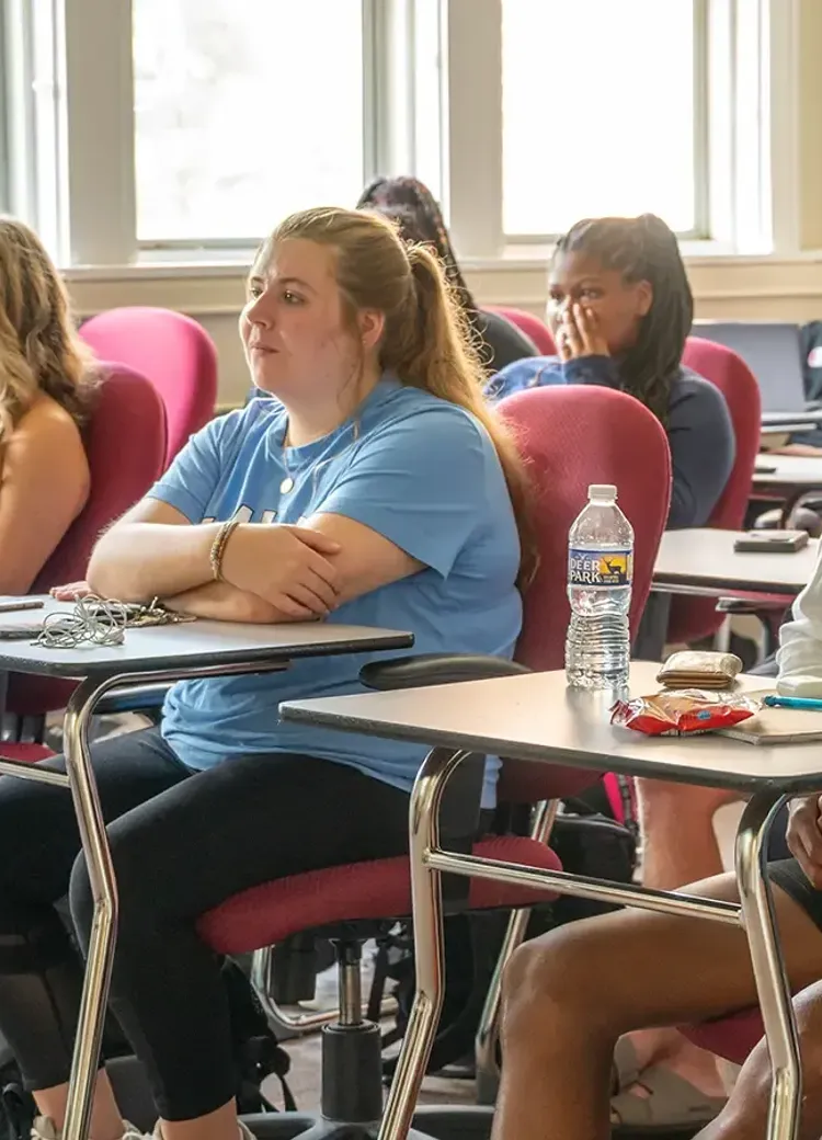 College students listen during a class in a Bethel classroom.